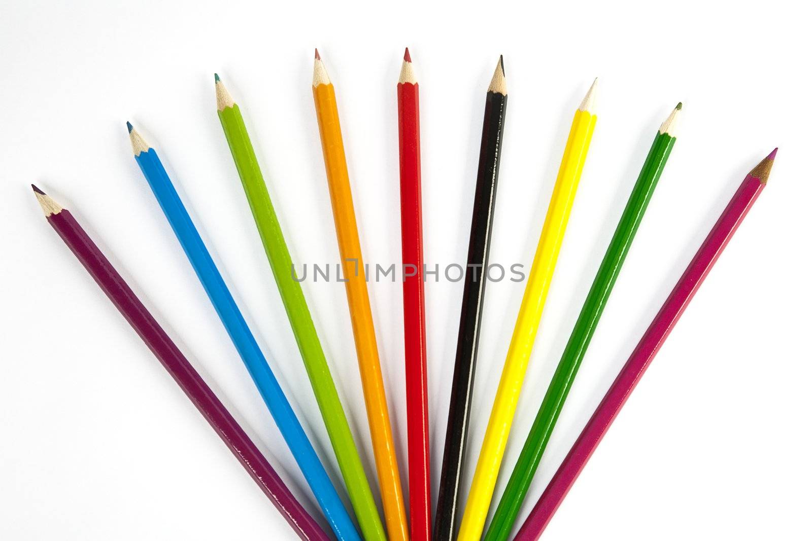 front view of color pencils over white background
