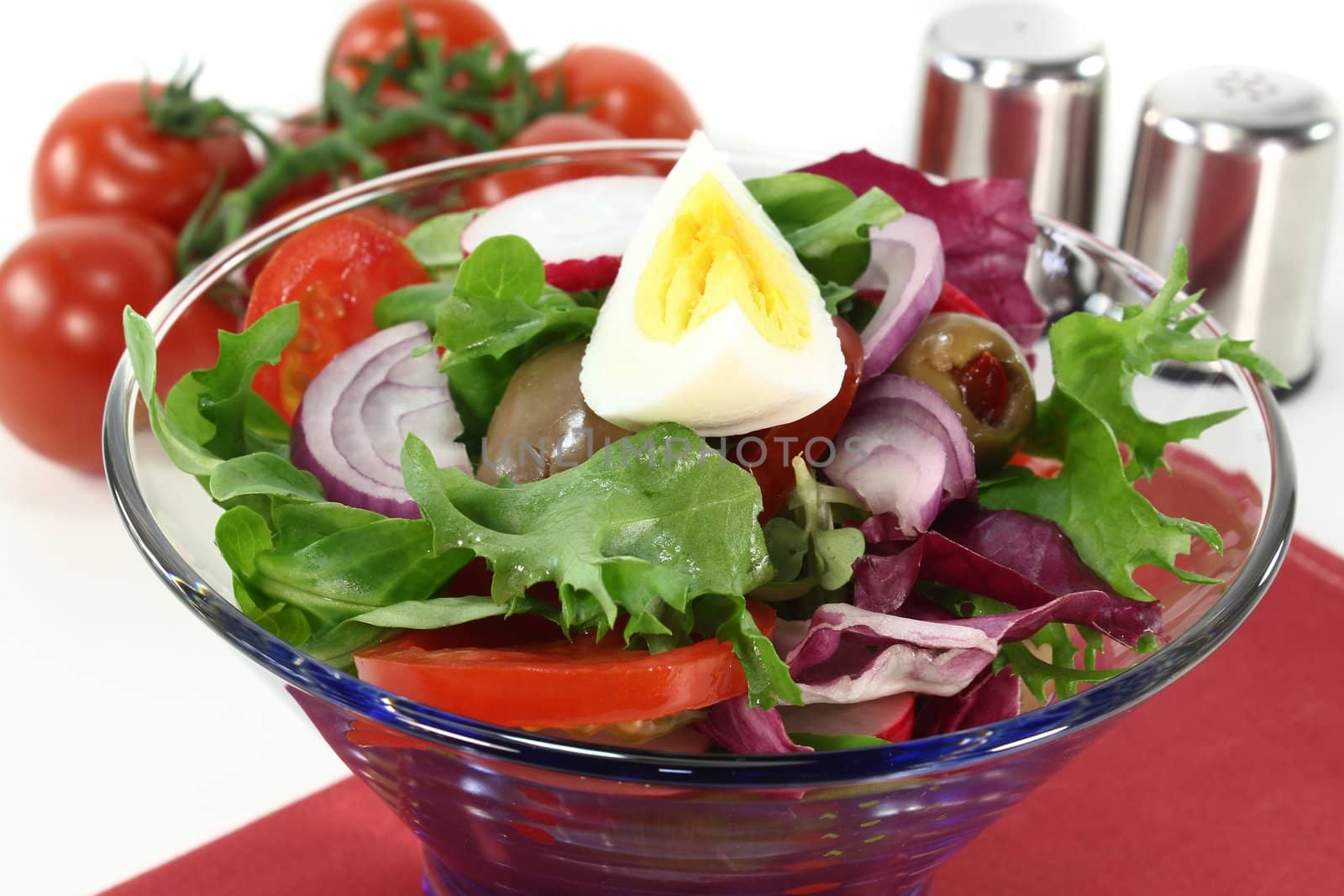 a blue bowl of fresh mixed salad