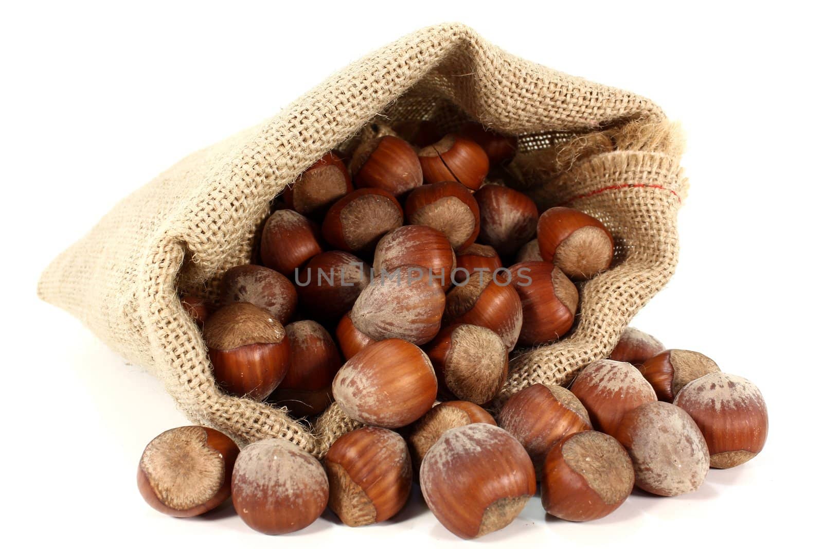 a burlap sack filled with hazelnuts