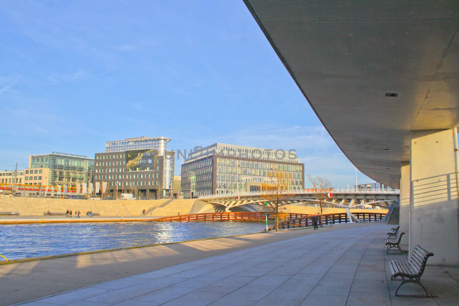 The bank of the river on a tranquil summer evening in the heart of the city.