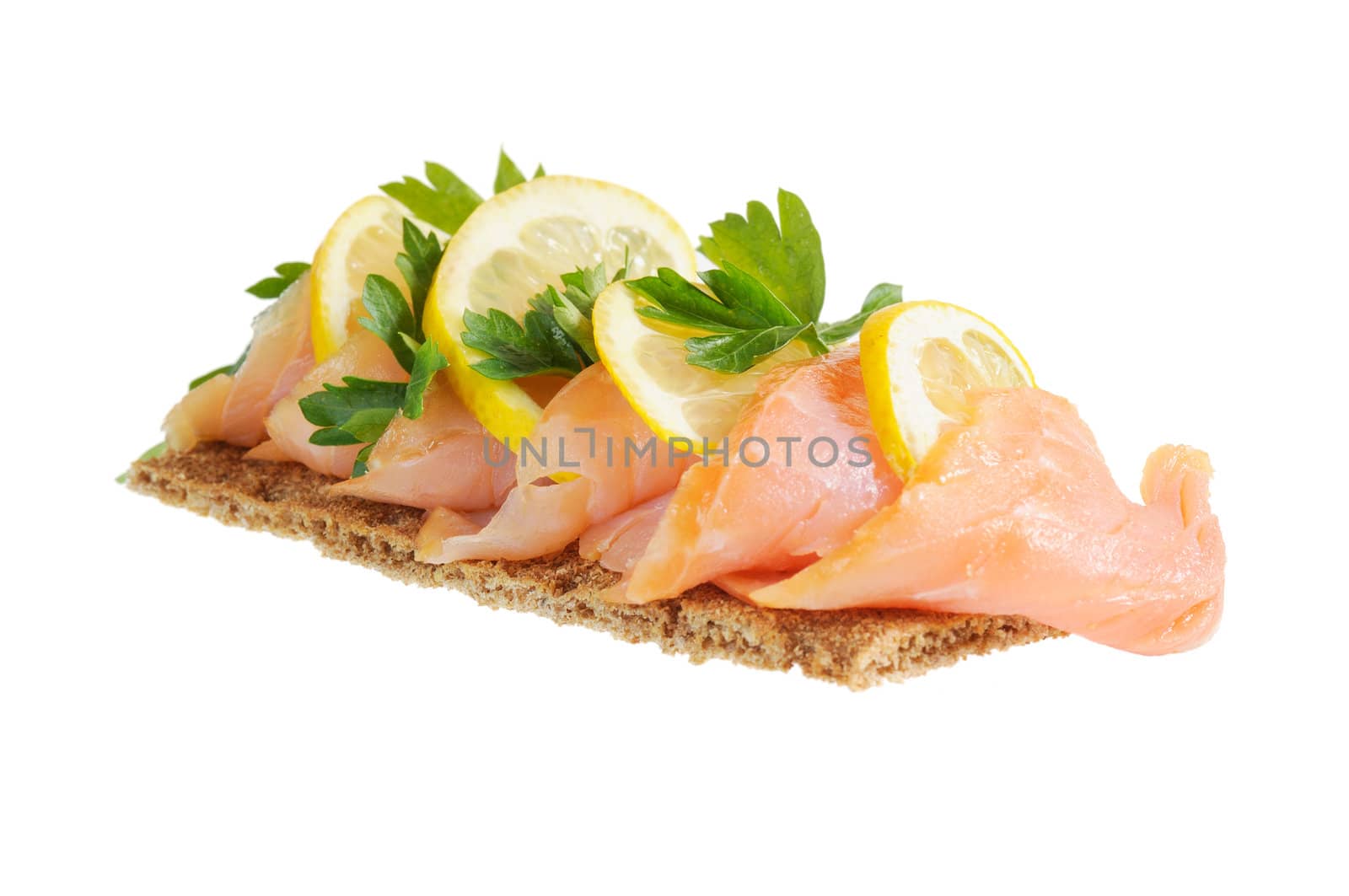 Sandwich snack - salmon with lemon on rye bread. Isolated on white.