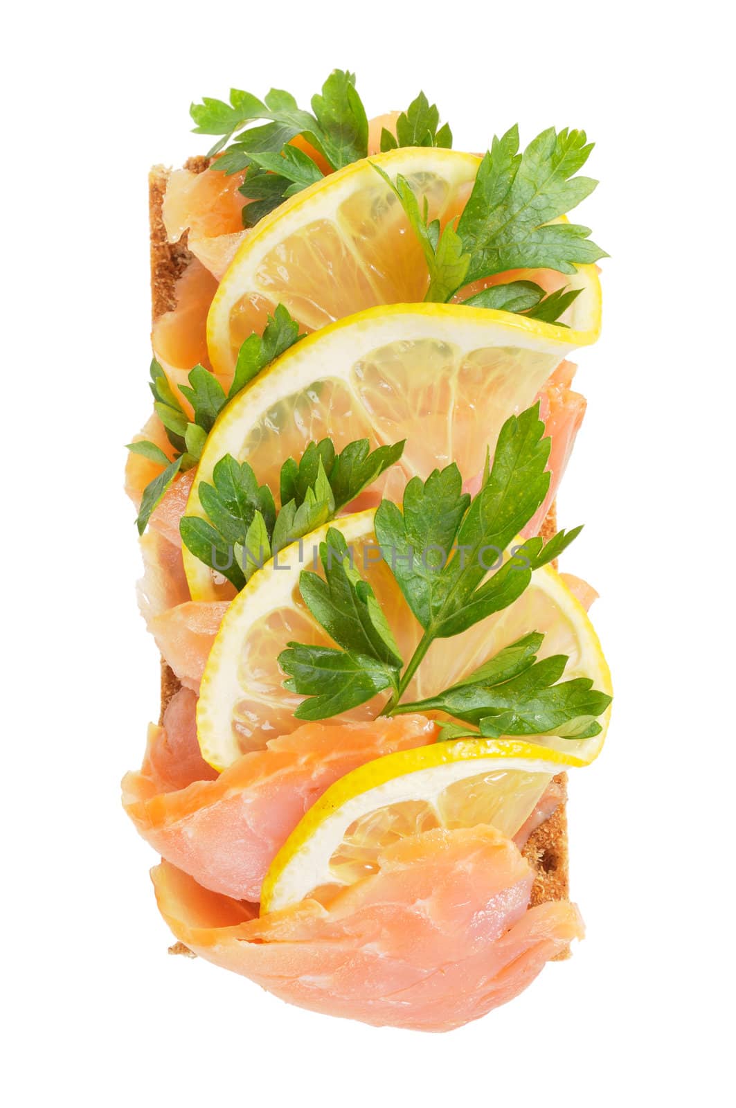 Sandwich snack - salmon with lemon on rye bread. Isolated on white.