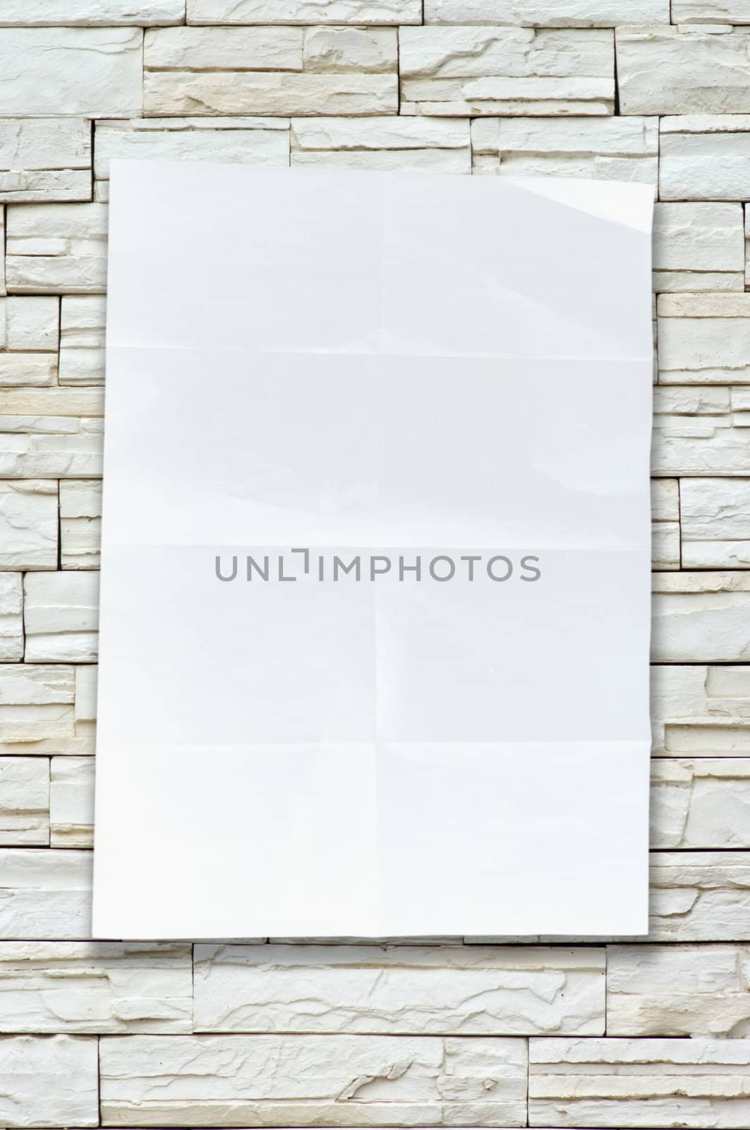 Empty white Crumpled paper on stone wall background vertical