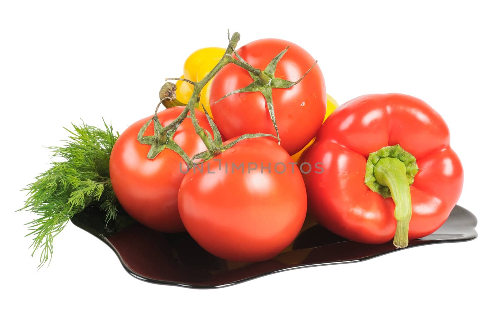 Vegetables - Tomatoes, peppers on a plate with dill. Isolated on white.