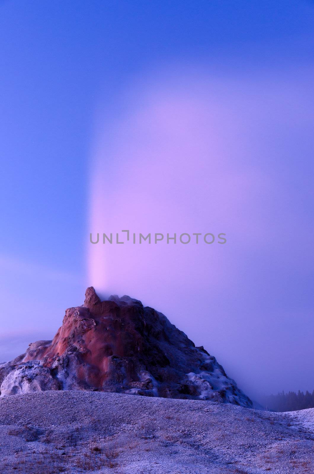 White Dome Geyser erupting after sunset, Yellowstone National Park, Wyoming, USA by CharlesBolin