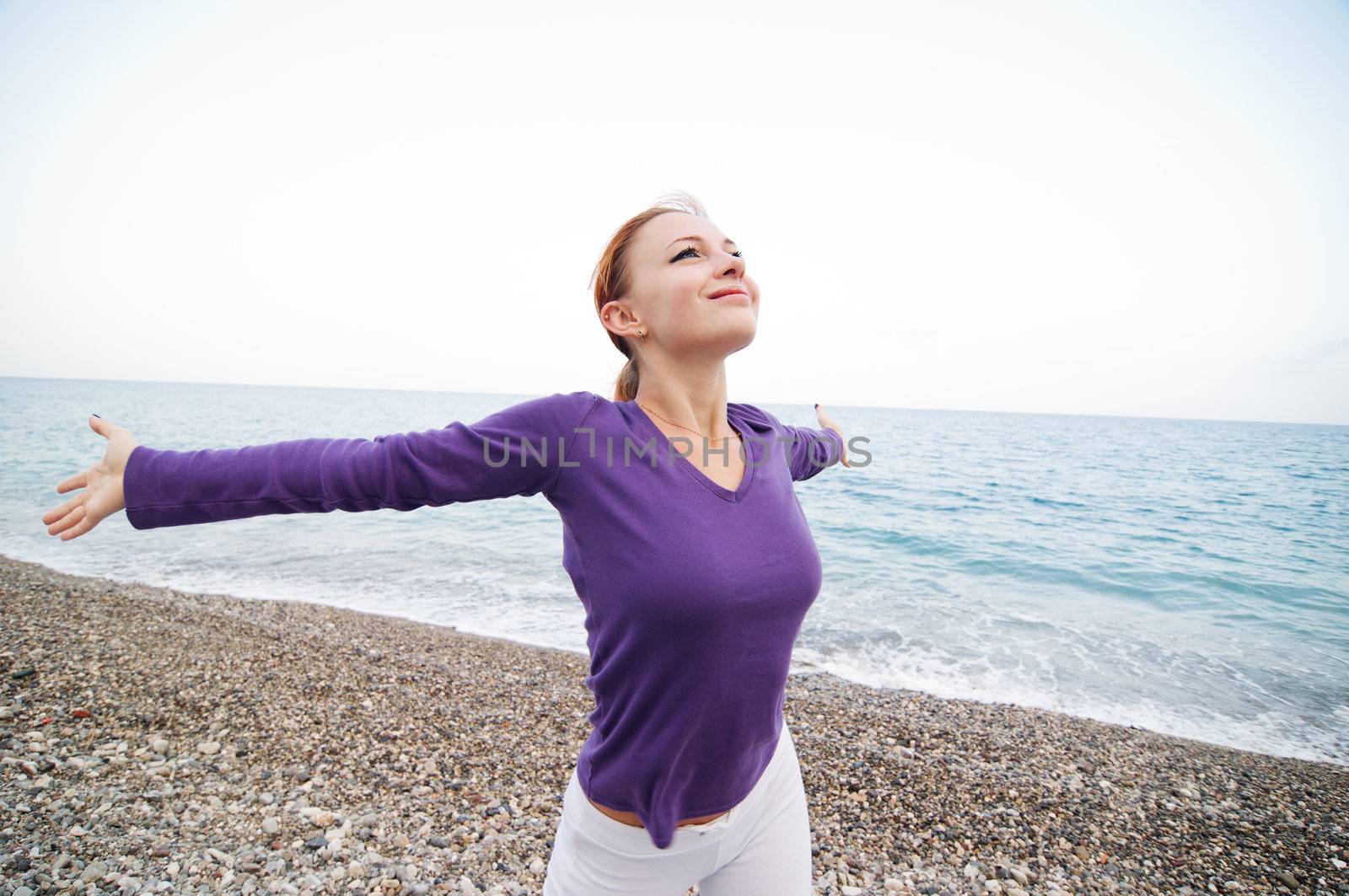 Woman with arms open enjoying peace and tranquility