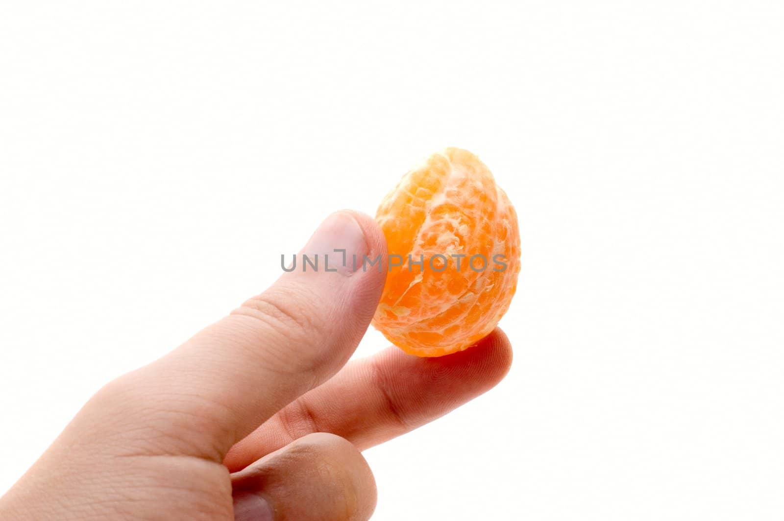 Man hand hold mandarin segment on white background