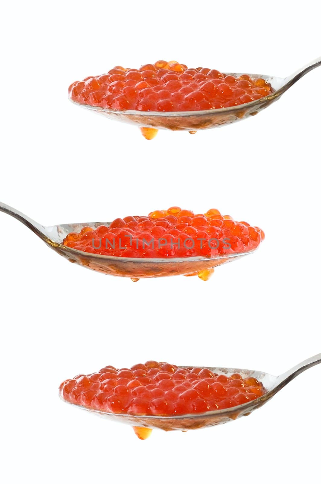 Caviar at spoon on white background