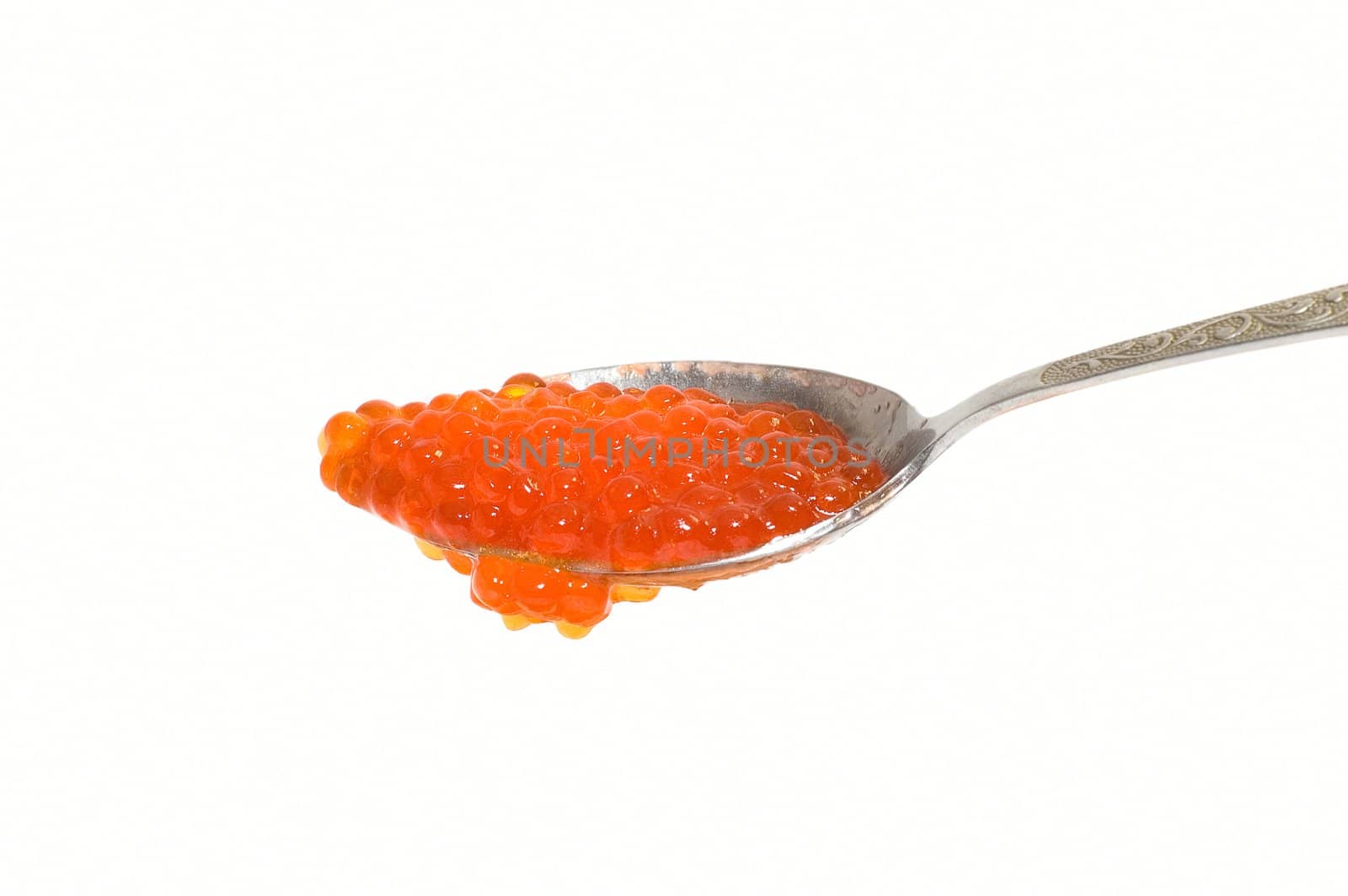 Red caviar at spoon on white background