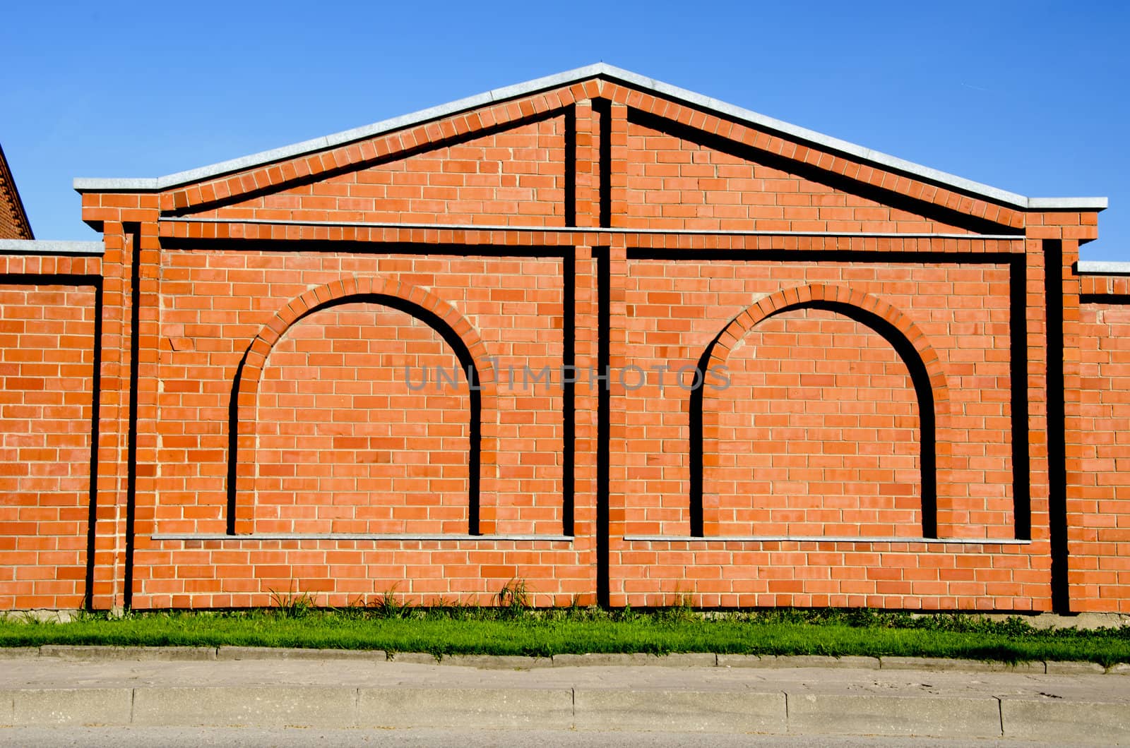 Red brick building with interesting wall decoration. Architectural bakground.