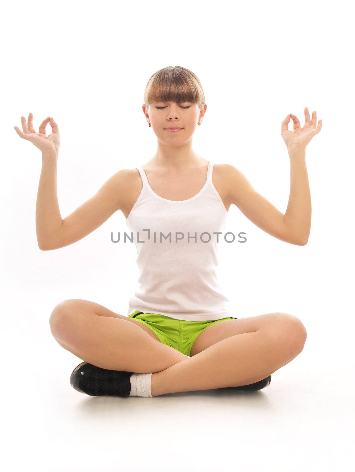  Young girl meditating in the lotus pose