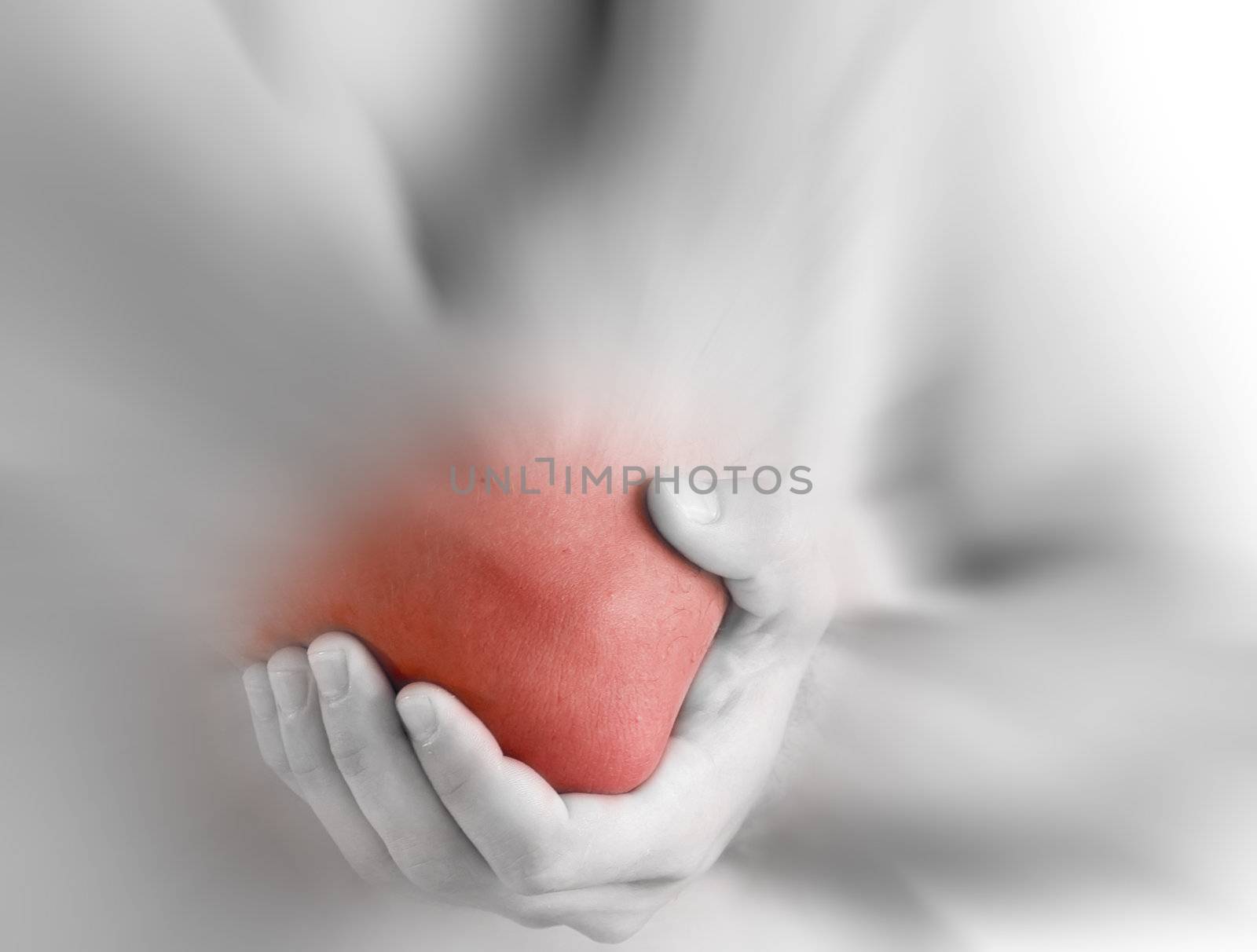 young man having pain in his elbow