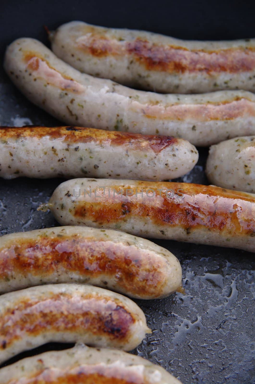 a sausage grilled on a camp fire