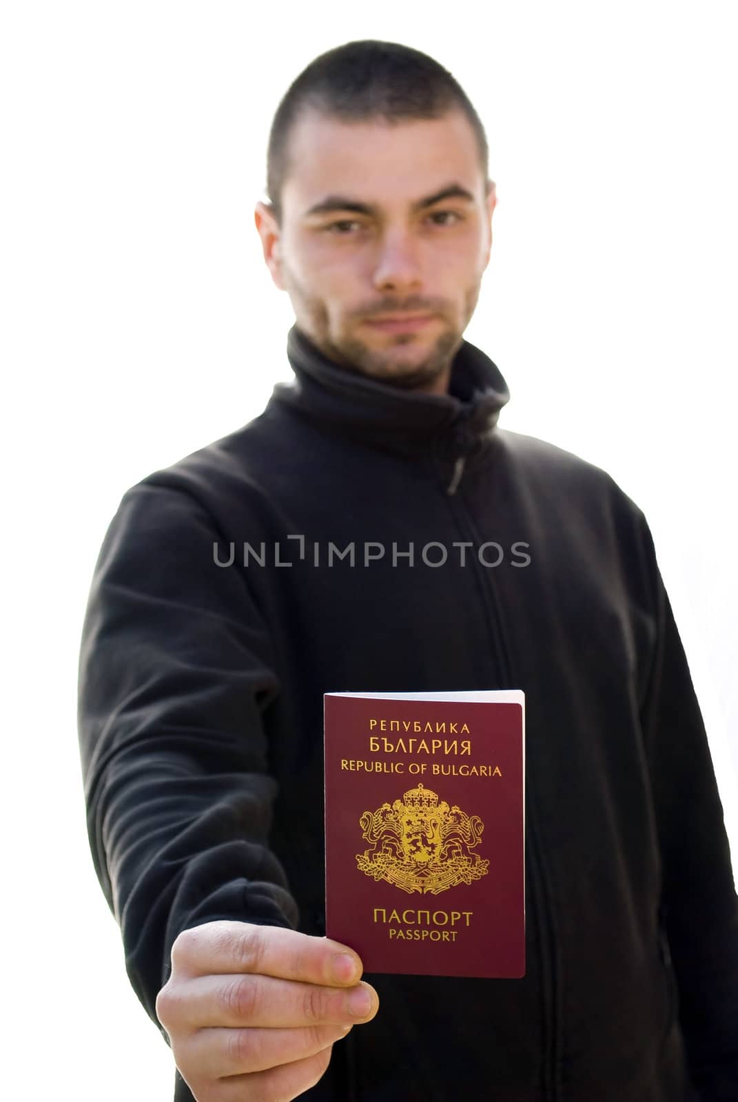 young man holding his passport isolated on white