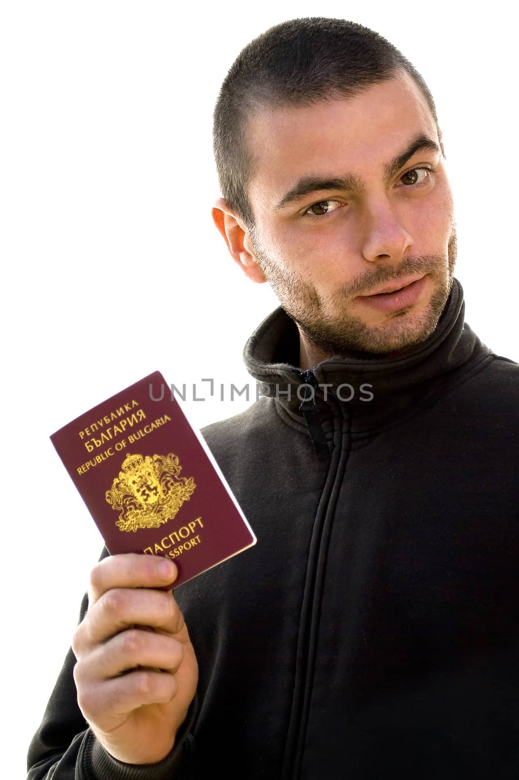 young man holding his passport isolated on white
