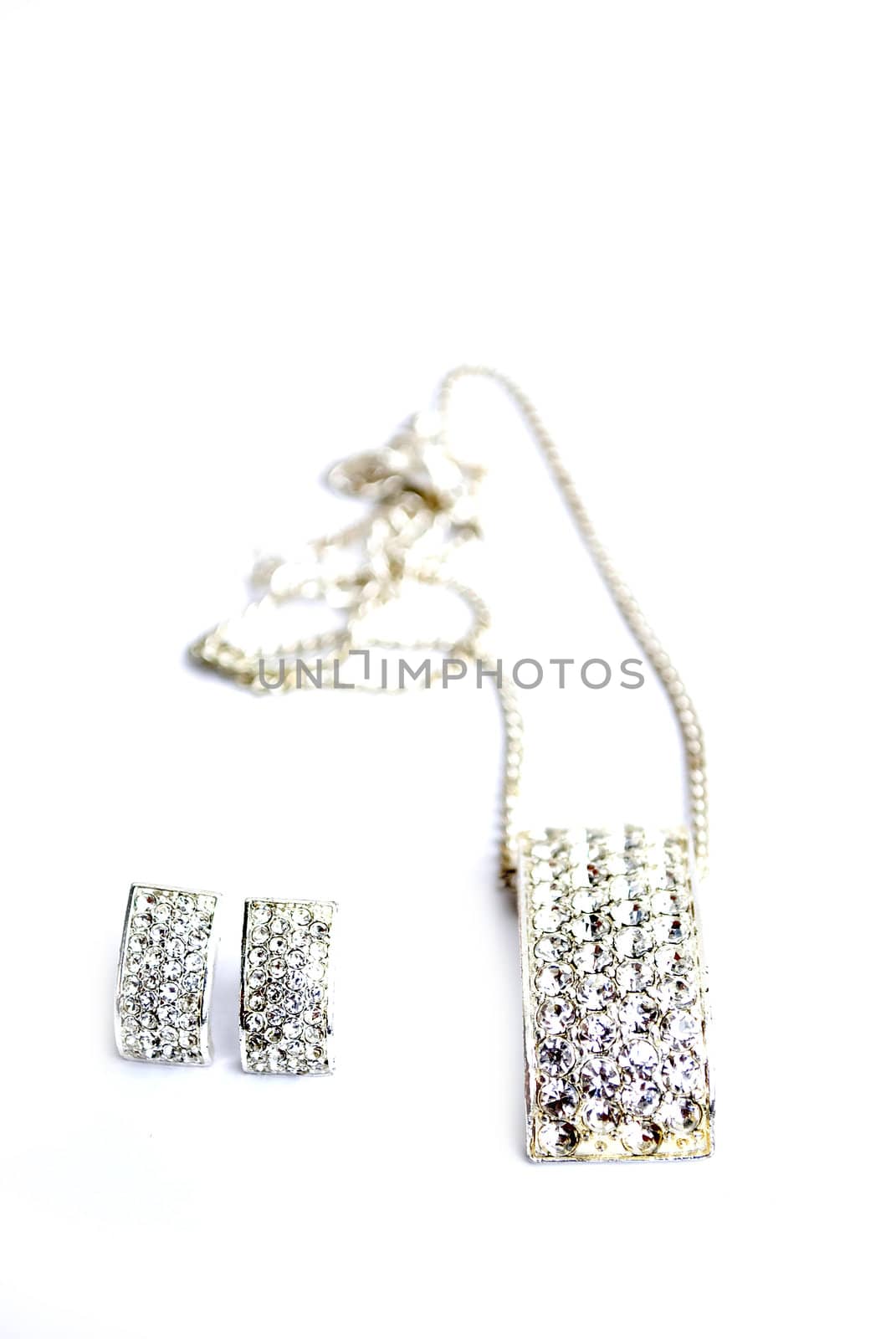 neckalce and earrings isolated on white background