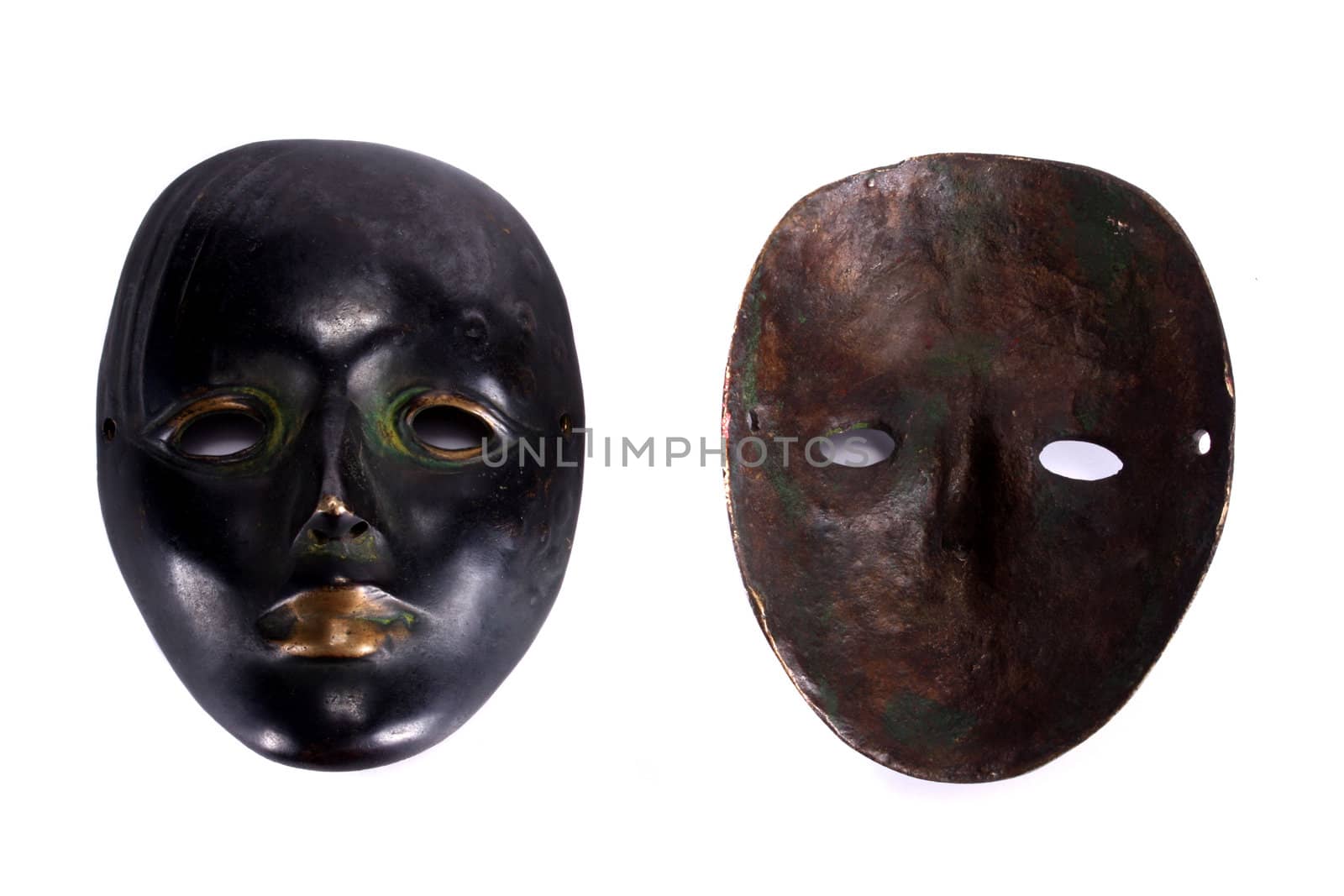 Both sides of the mask showing its front artistic face and the rusty backside.