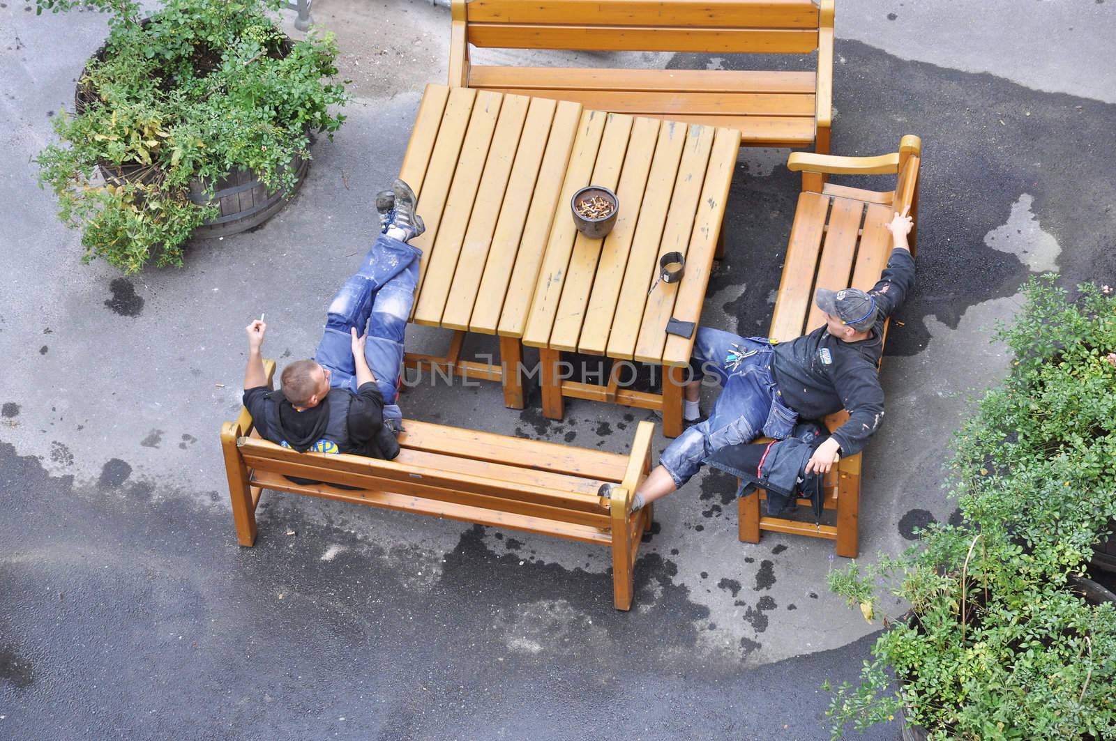 Balcony builders having a break in a backyard in Sodermalm in Stockholm, Sweden. Picture was taking on september 28 2011.