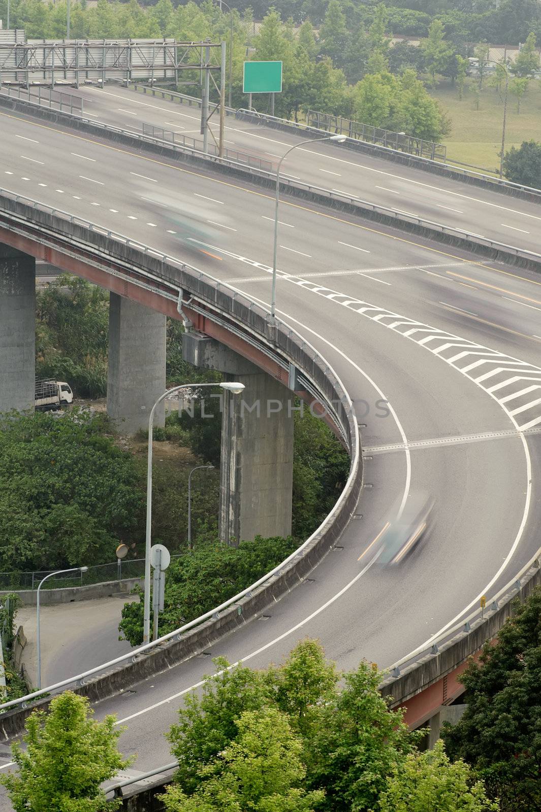 Interchange in highway with cars motion blurred in daytime in Taipei, Taiwan, Asia.