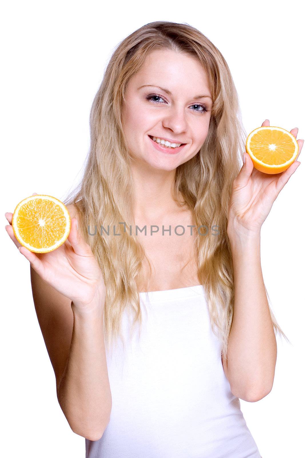 smiling young haelthy woman holding the orange in her hand