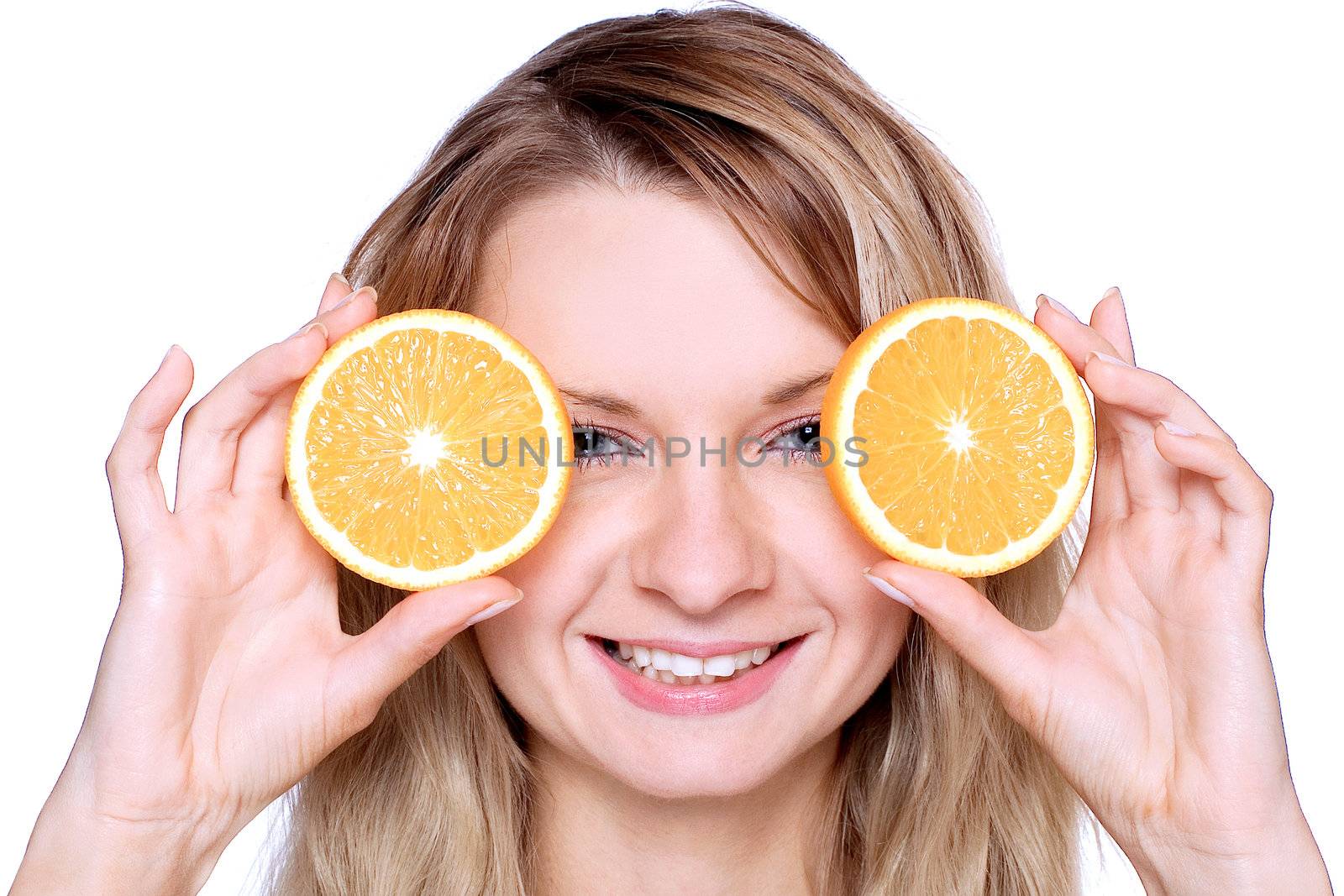 smiling young haelthy woman holding the orange in her hand