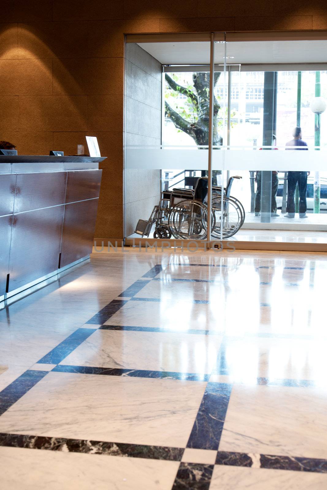 An hospital entry with wheel chair and reception