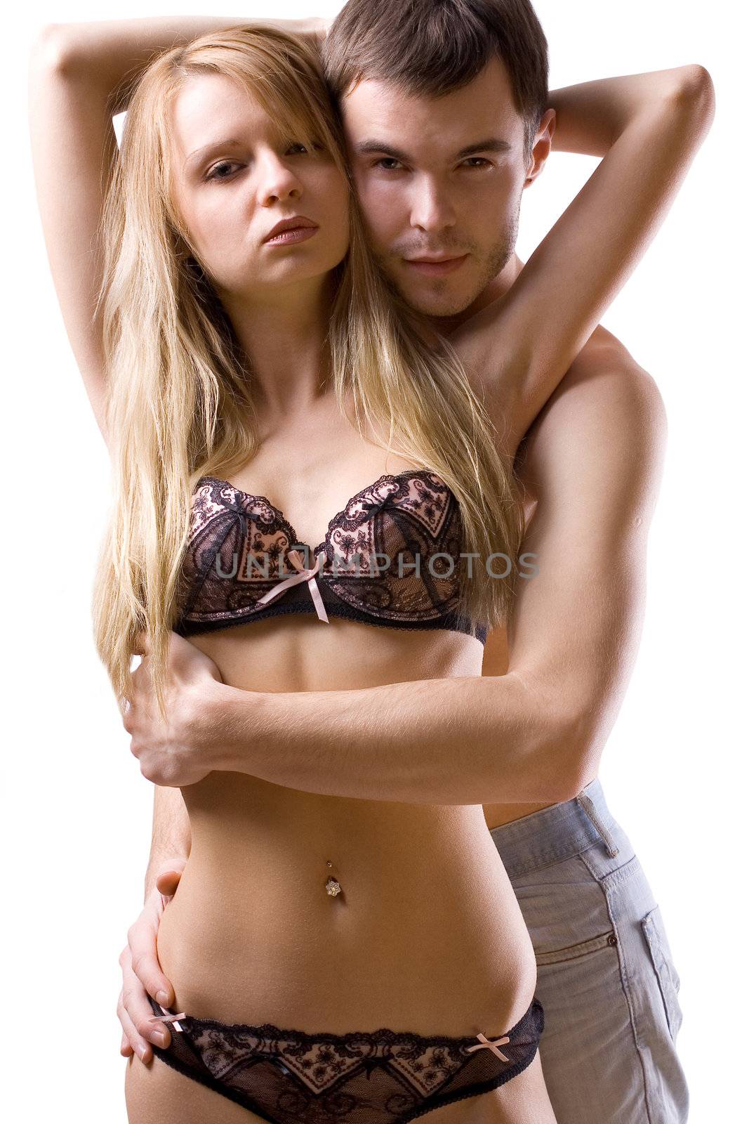 fashion shot of a beautiful couple holding each other