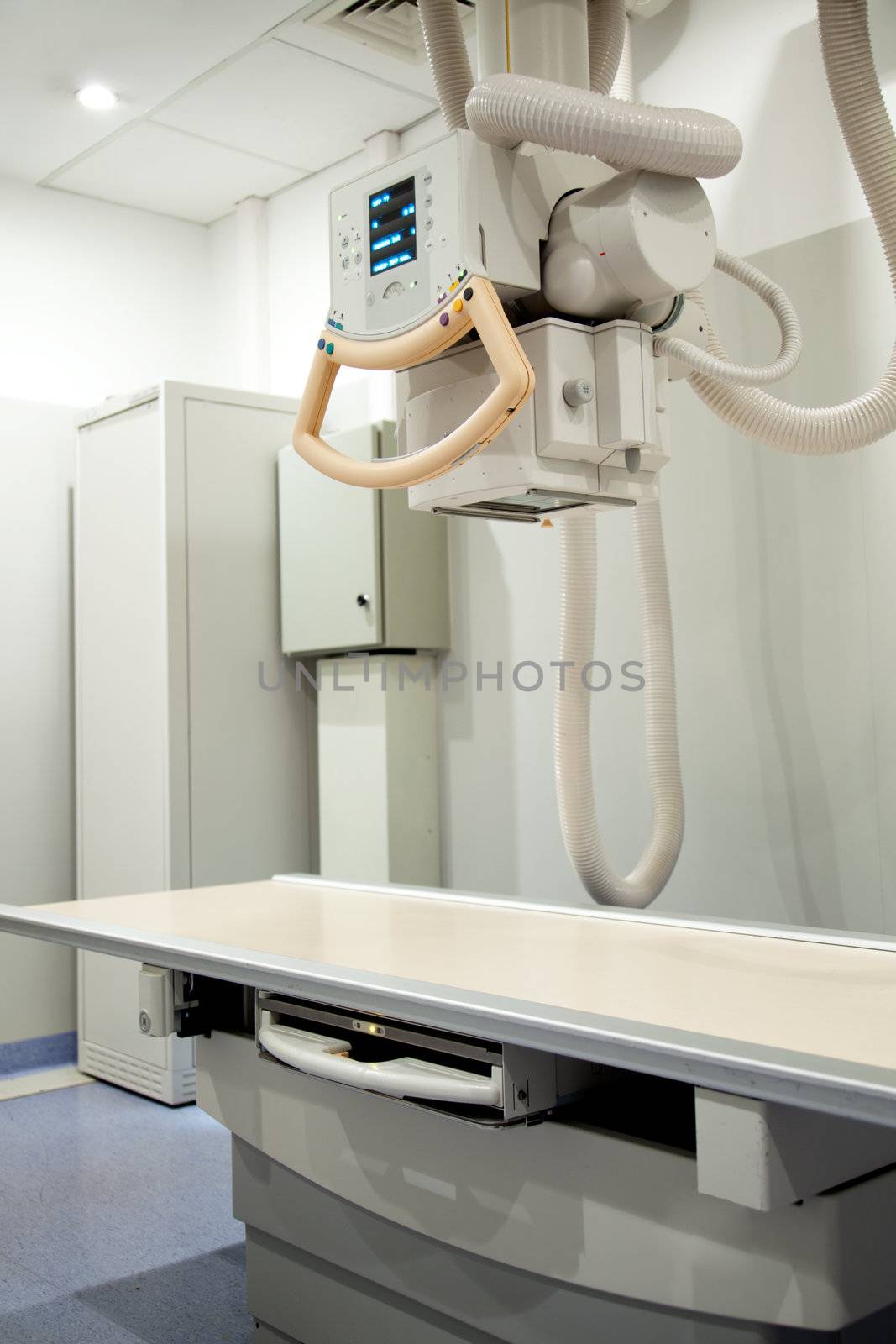 An x-ray machine with x-ray table in a hospital
