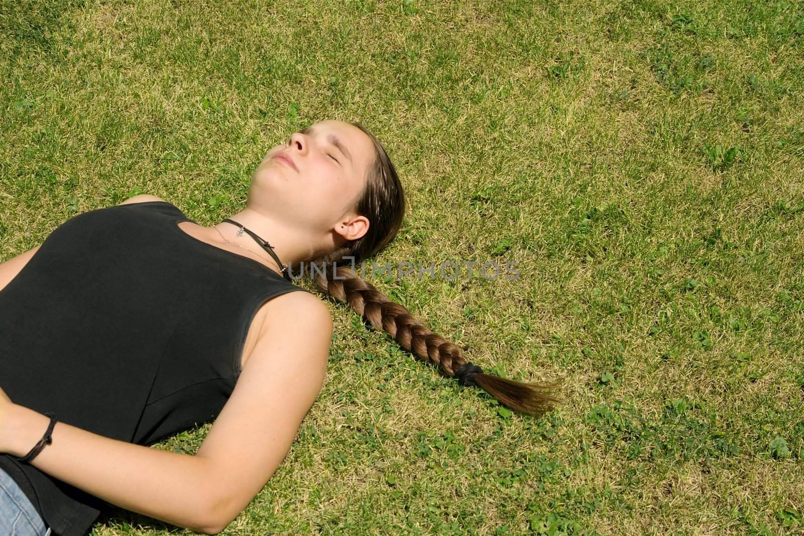 Girl relaxing in the grass
