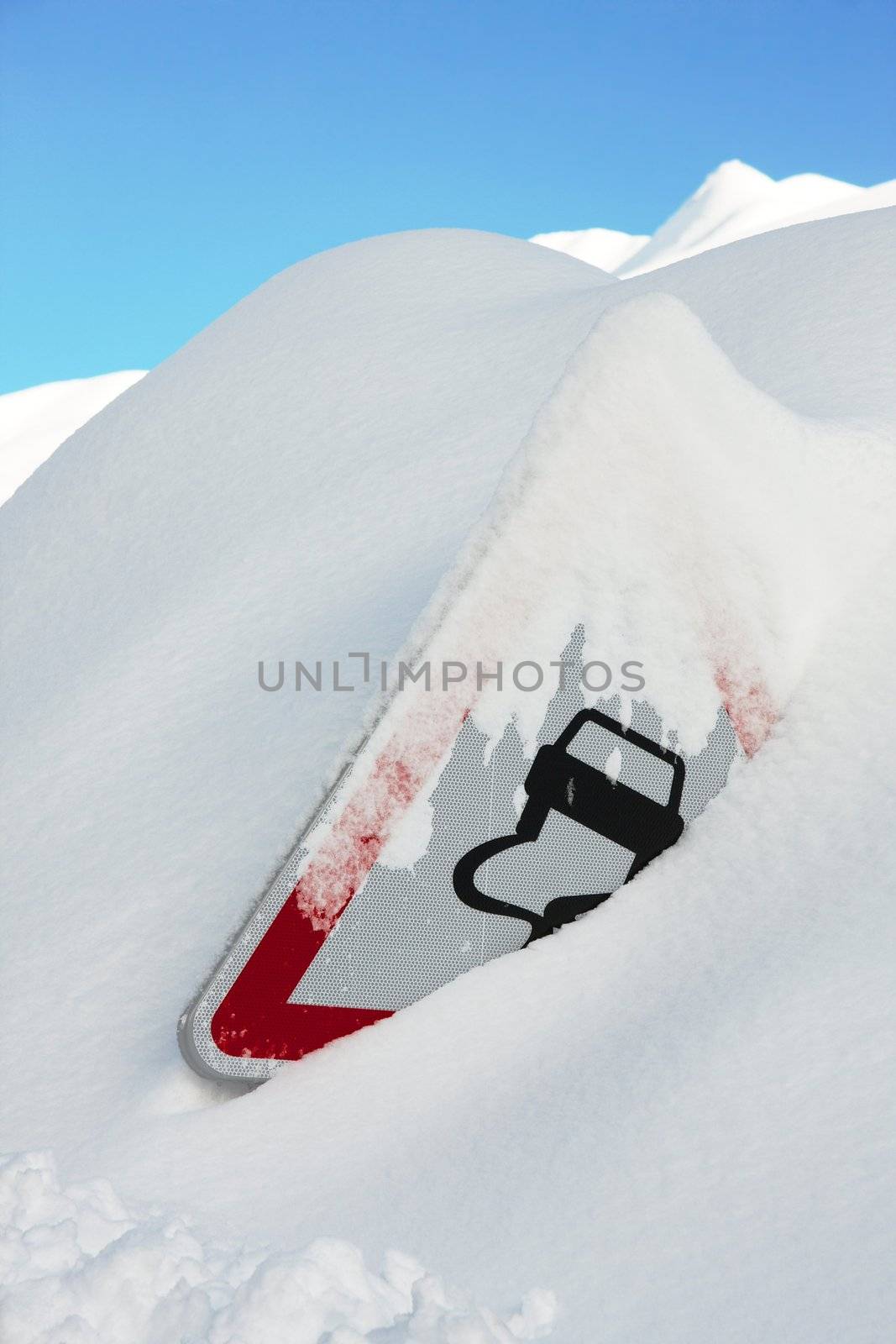 Traffic sign covered by a lot of snow