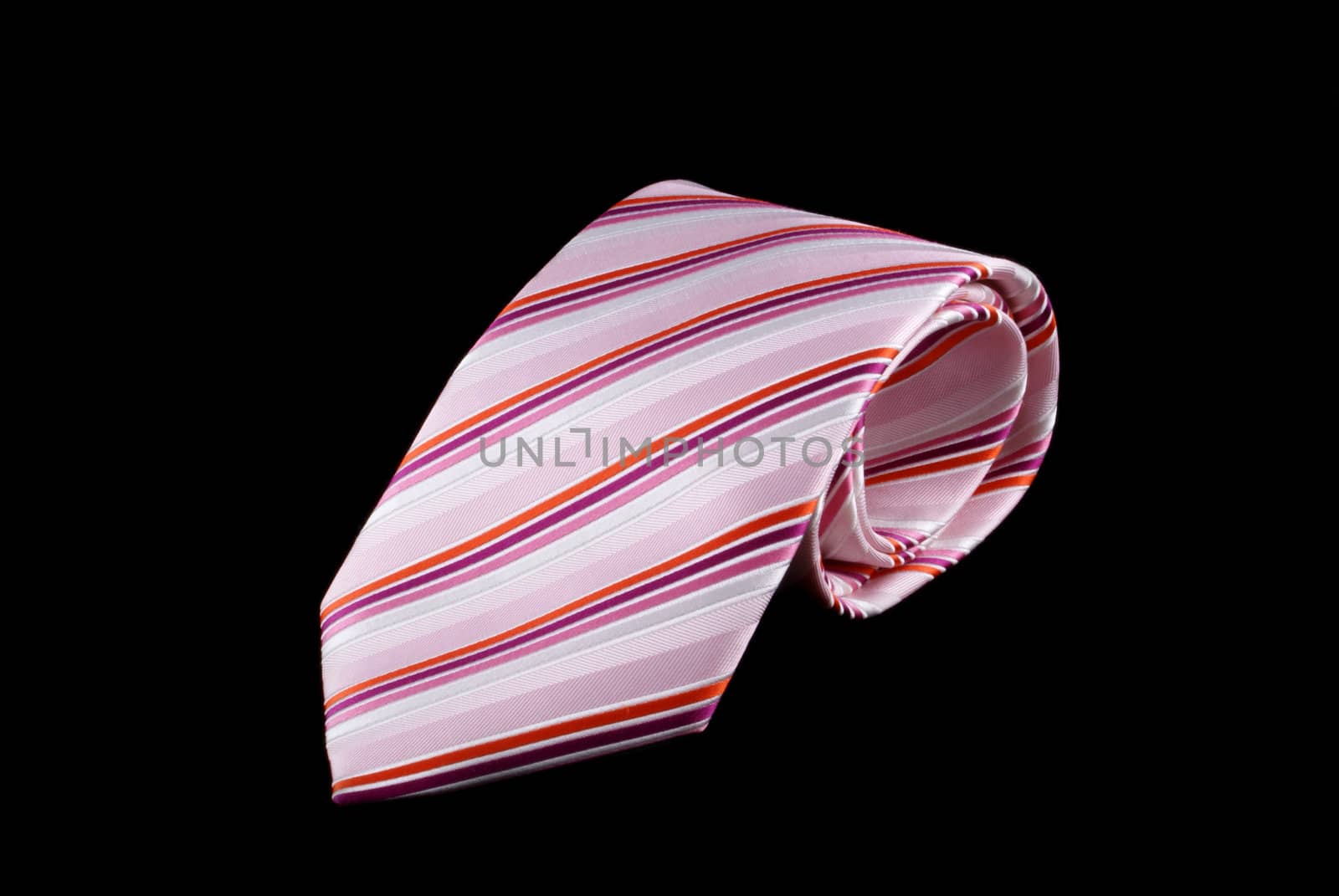 Pink striped tie on a black background.