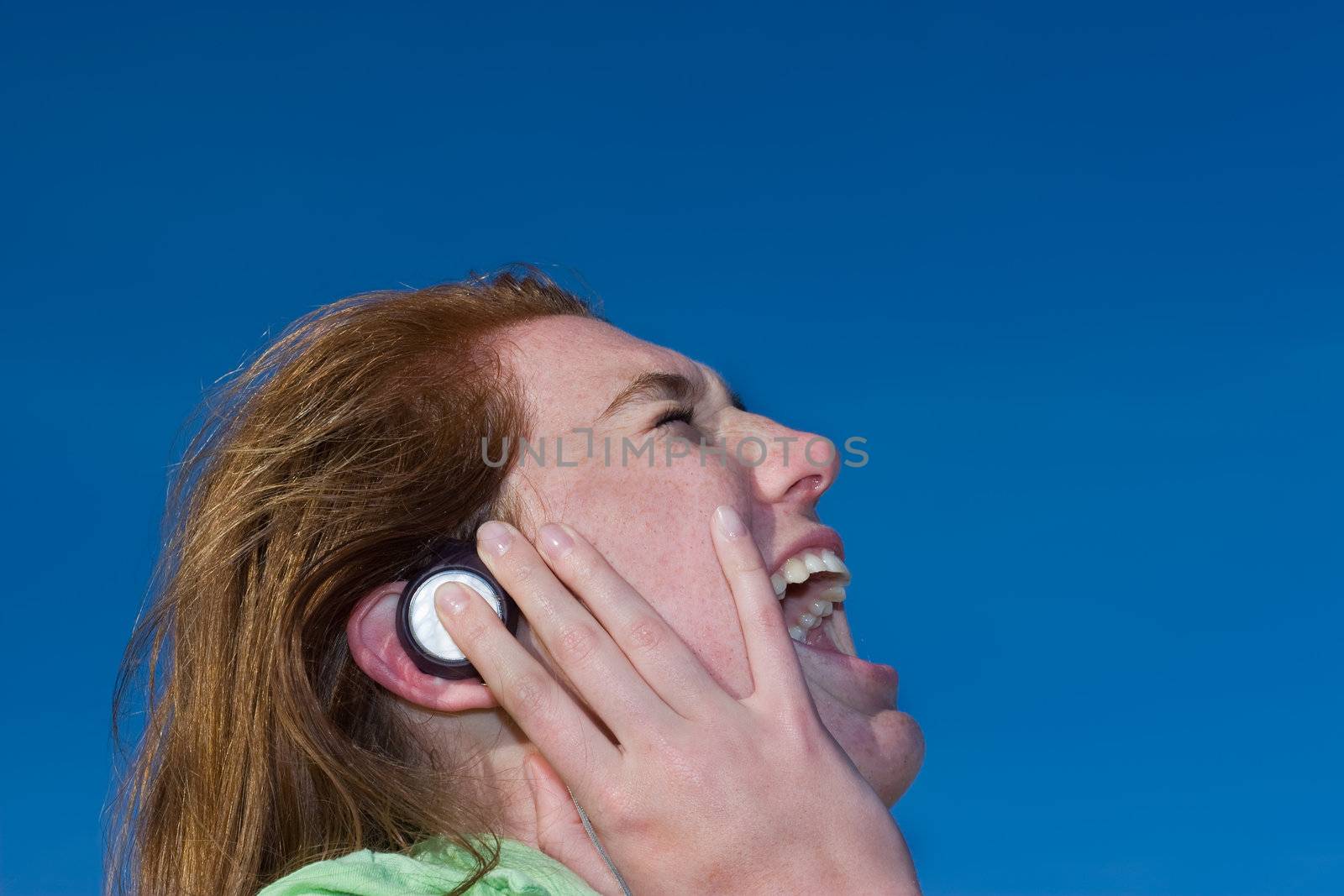 Young lady singing along to the music