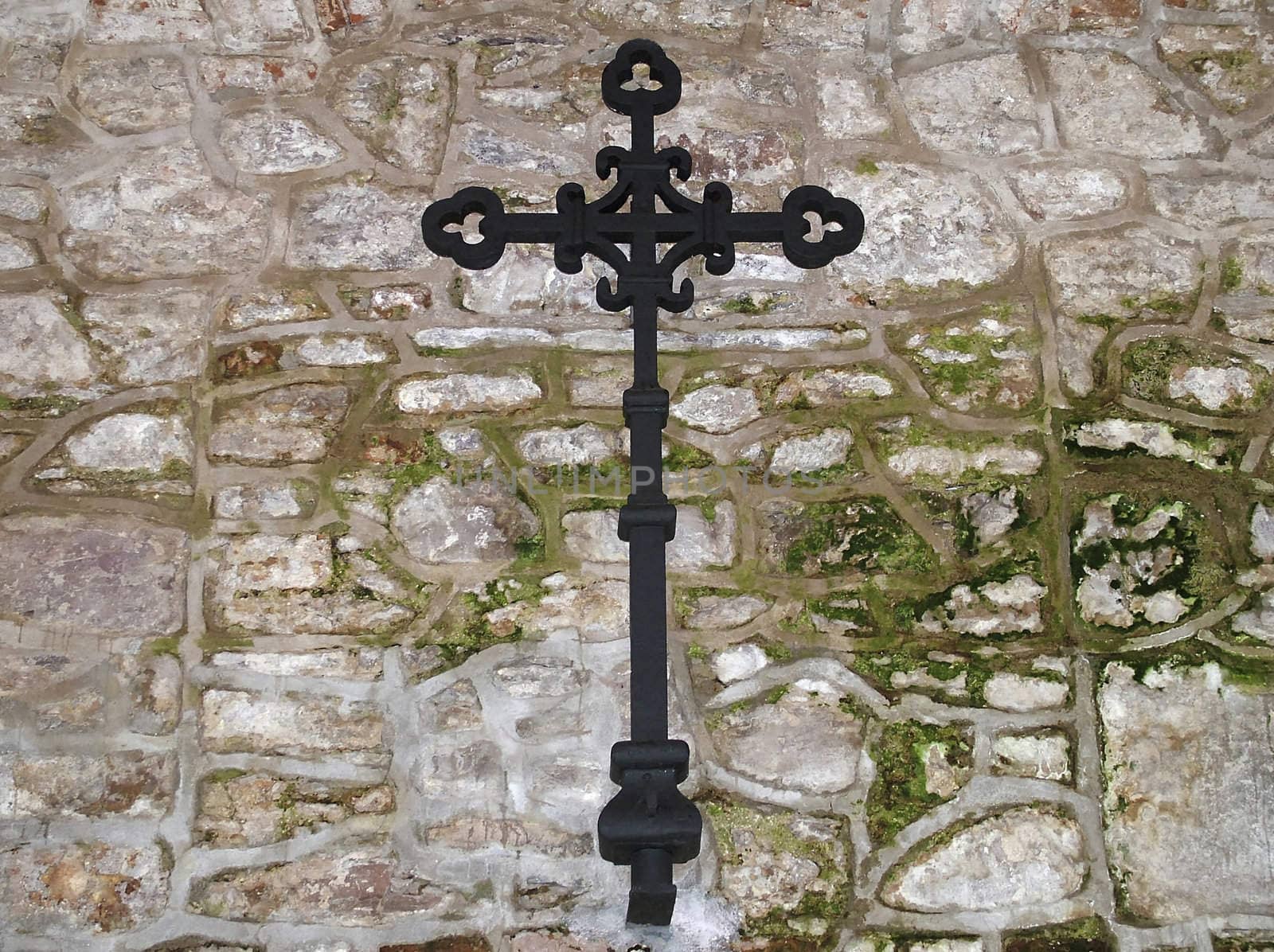 iron cross on church wall