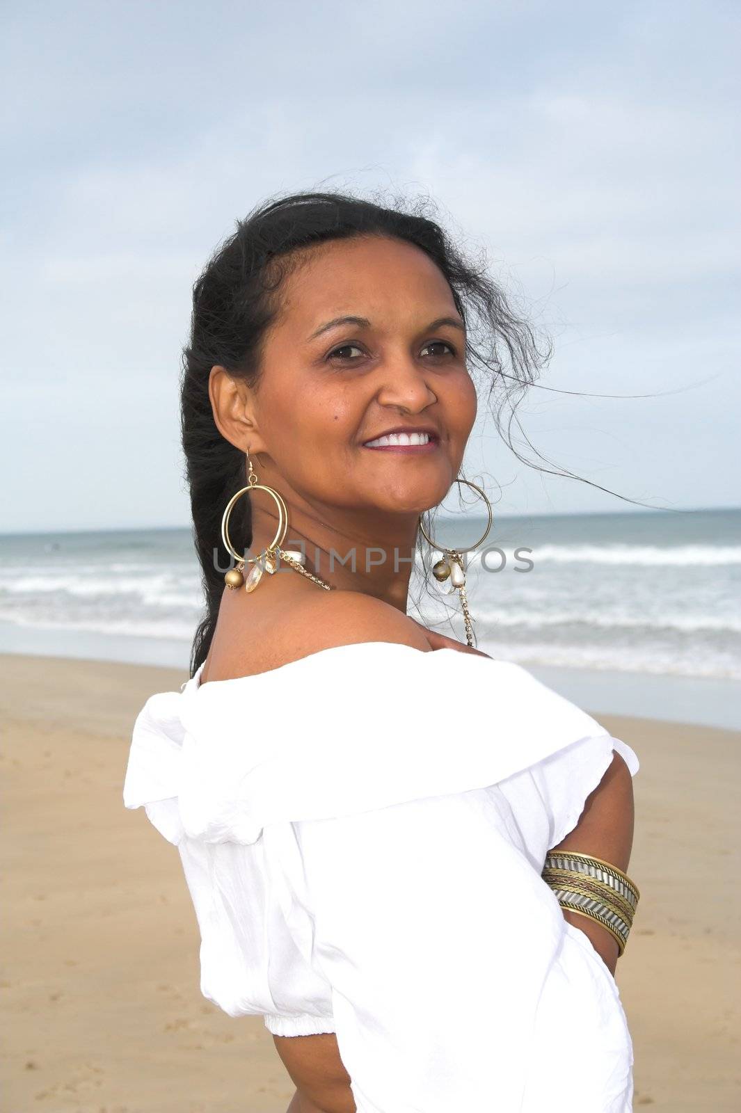 An Ethnic model posing at the beach