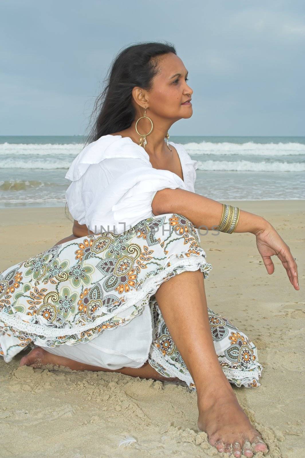 An American Indian woan relaxing at the beach