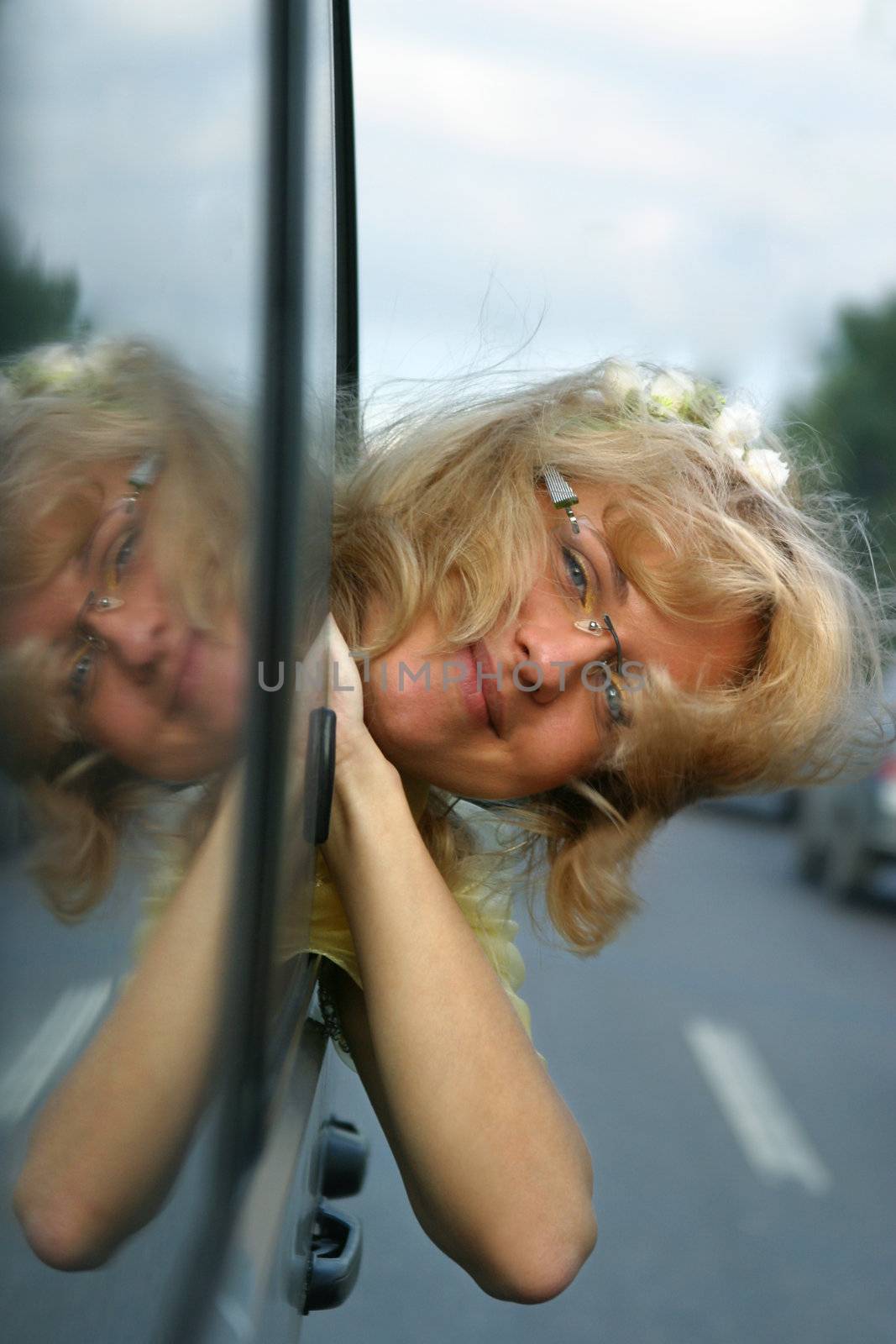 Smiling girl in the automobile