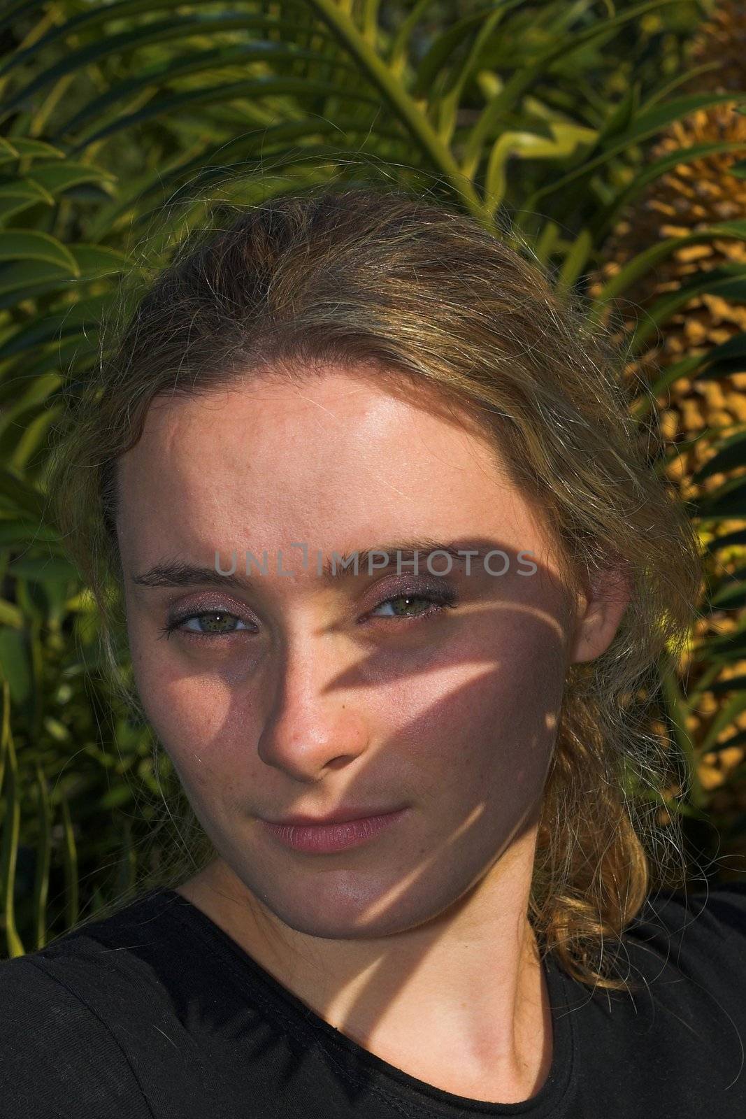 Attractive girl with shadows over her face