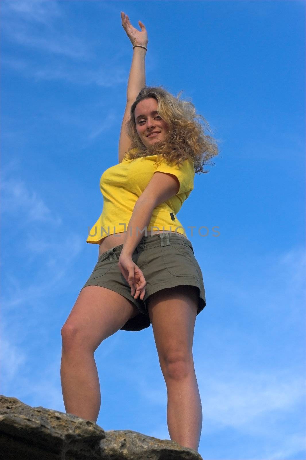 Girl in yellow top and Khaki Shorts