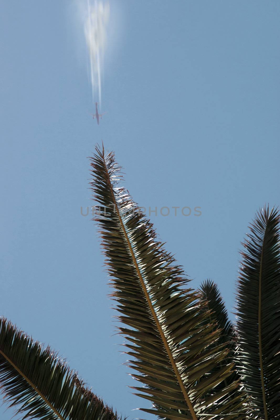 plane in flight leaving a carbon trail