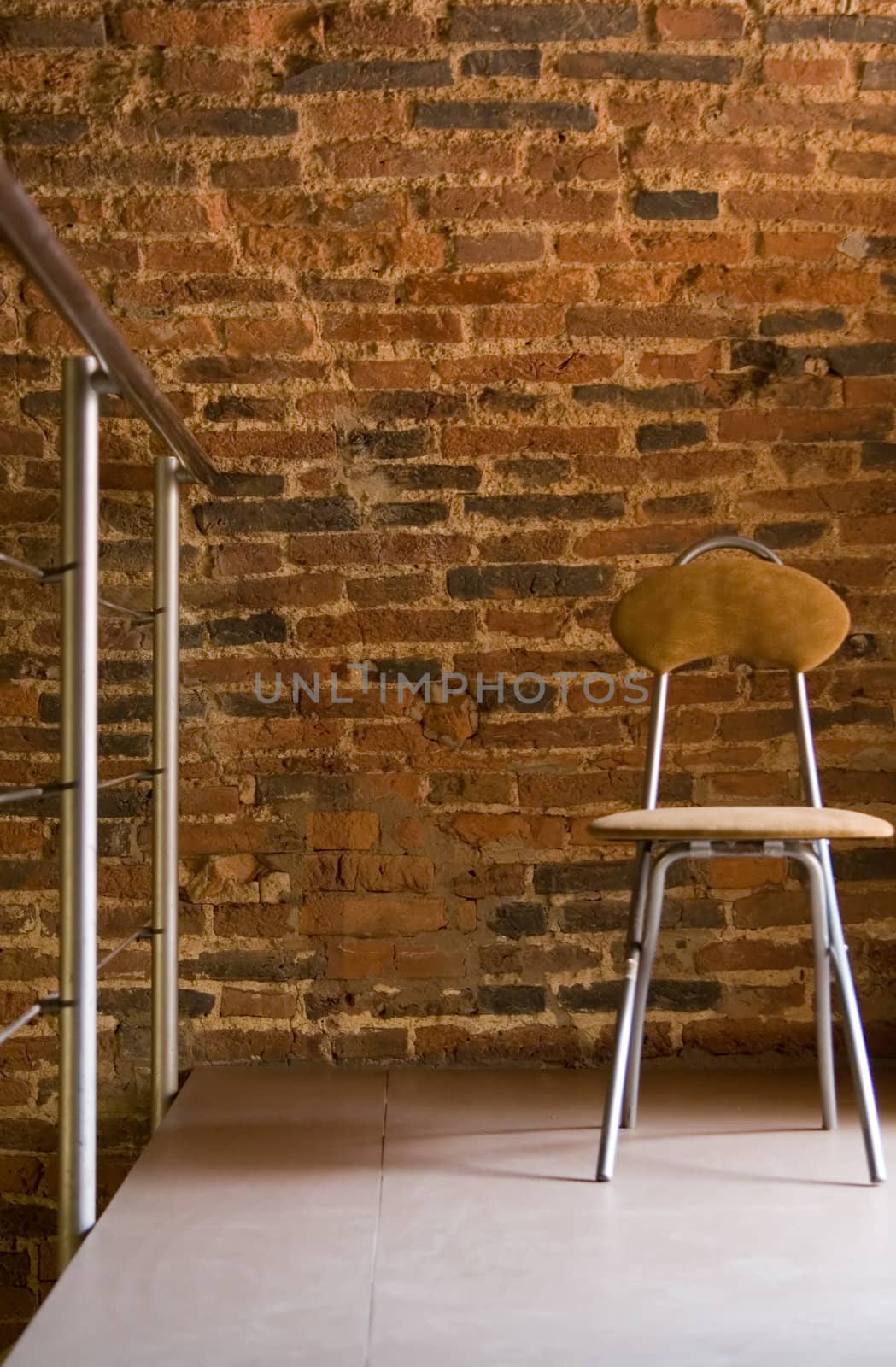 The steel chair befor a brick wall by Ravenestling