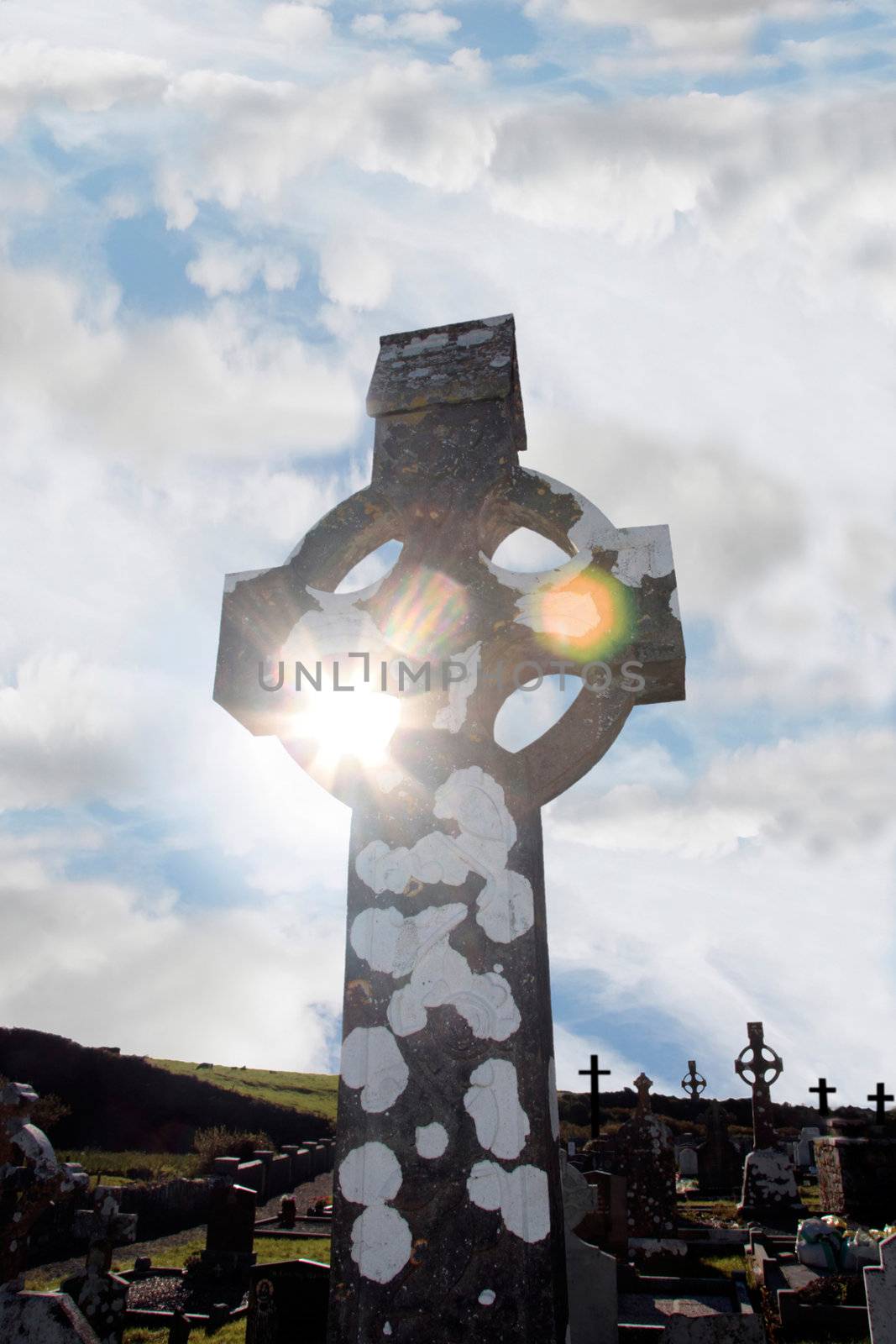 a celtic cross in an irish graveyard