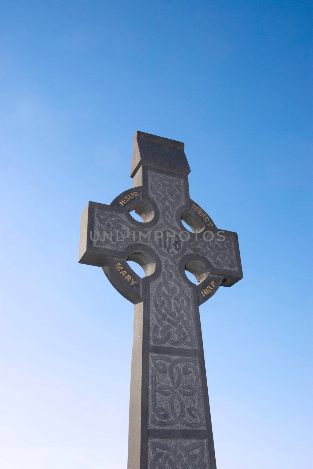 a celtic cross in an irish graveyard
