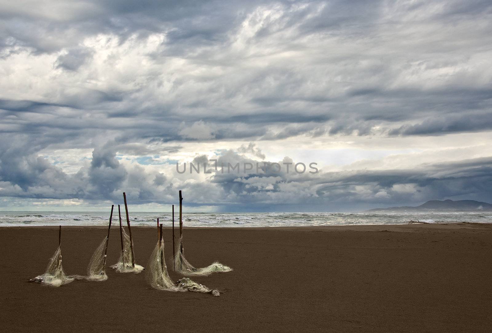 old fishing nets on the beach during a thunderstorm