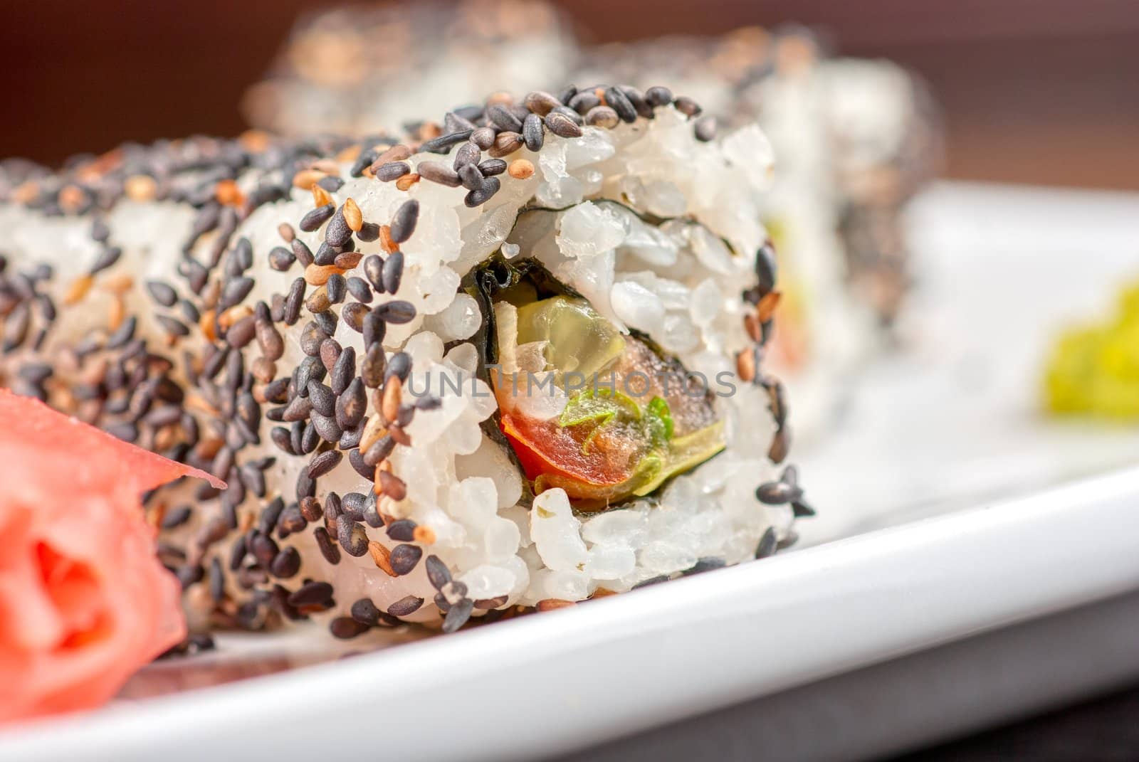 Closeup of Sushi rolls at plate with sesame