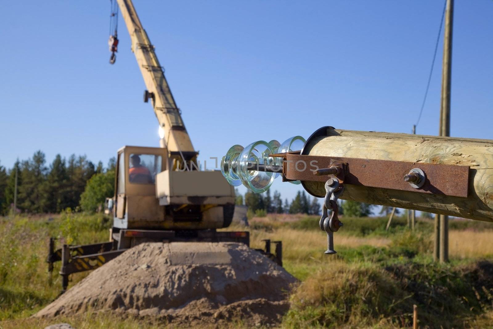 Replacing old power line supports using the crane