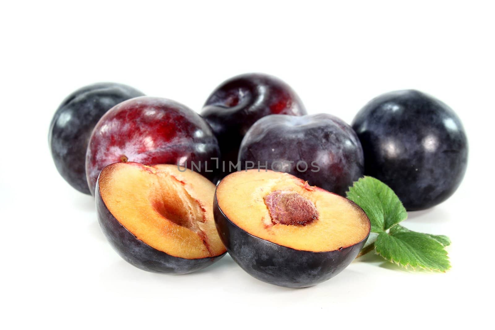 fresh plums on a white background