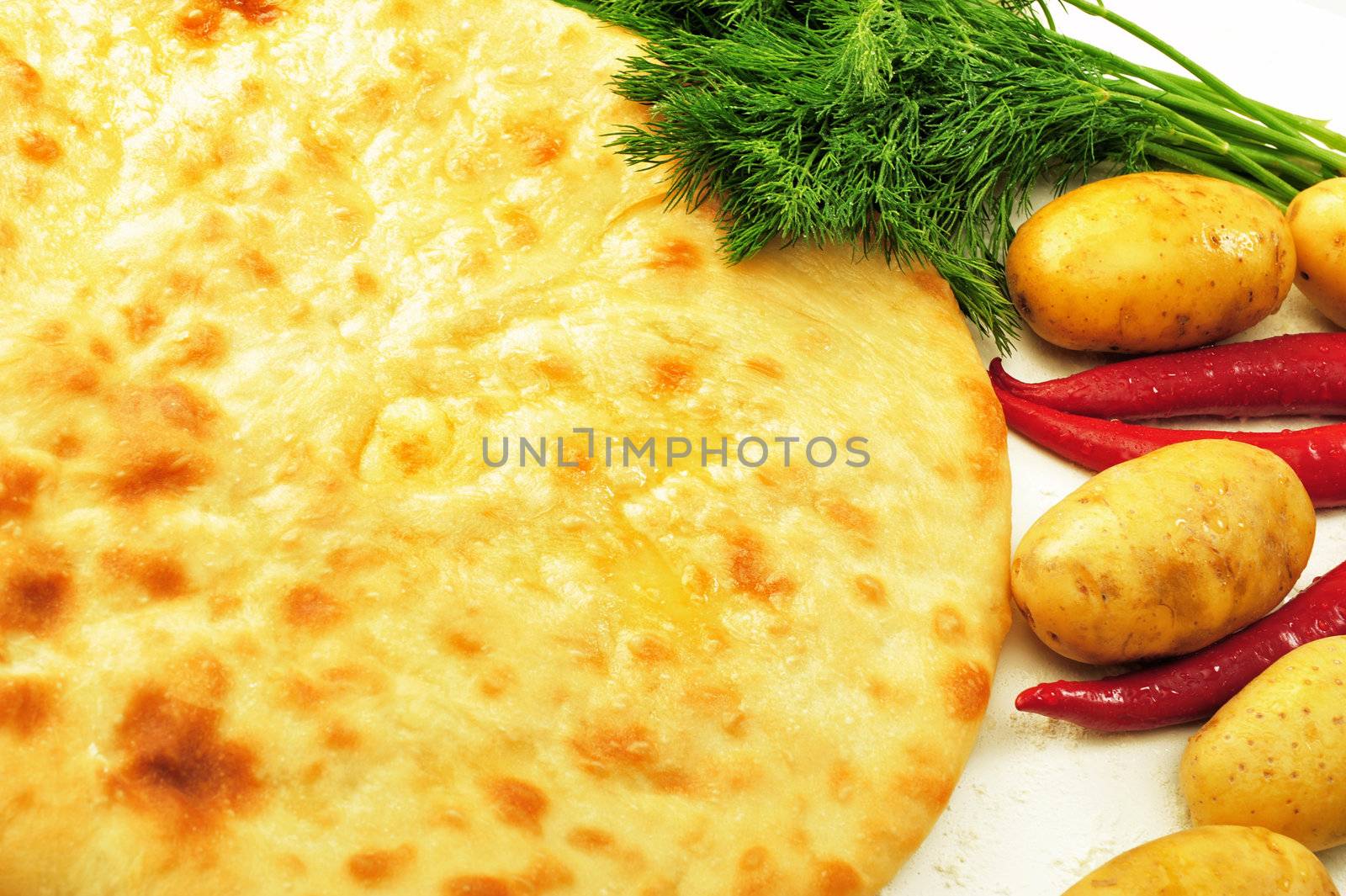 food composition made of flat cake, potato, cayenne, parsley and spring onion
