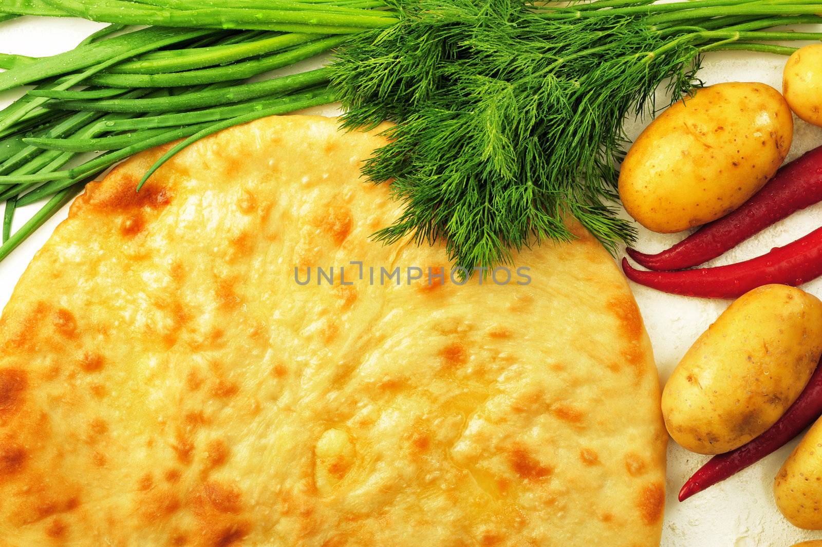 food composition made of flat cake, potato, cayenne, parsley and spring onion