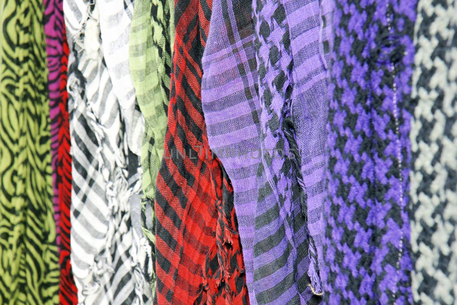 Row of colorful keffieh or keffiyah scarves, symbolic of the palestian and arabic world.