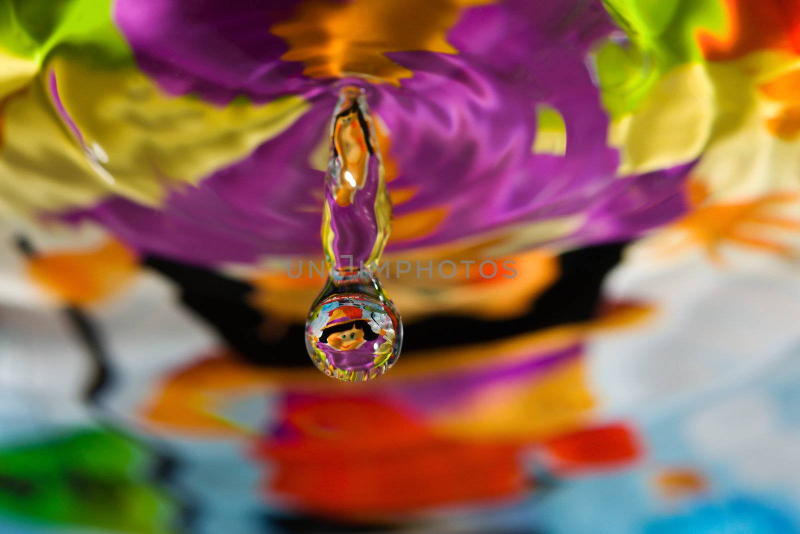 Macro photography of colorful water drop collision sculpture.